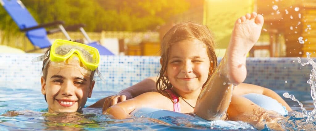 two kids swimming.