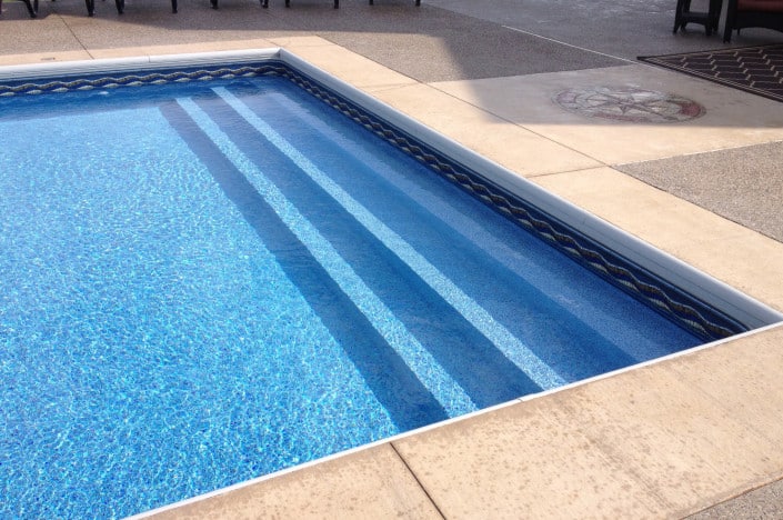 Pool with steps across full width.