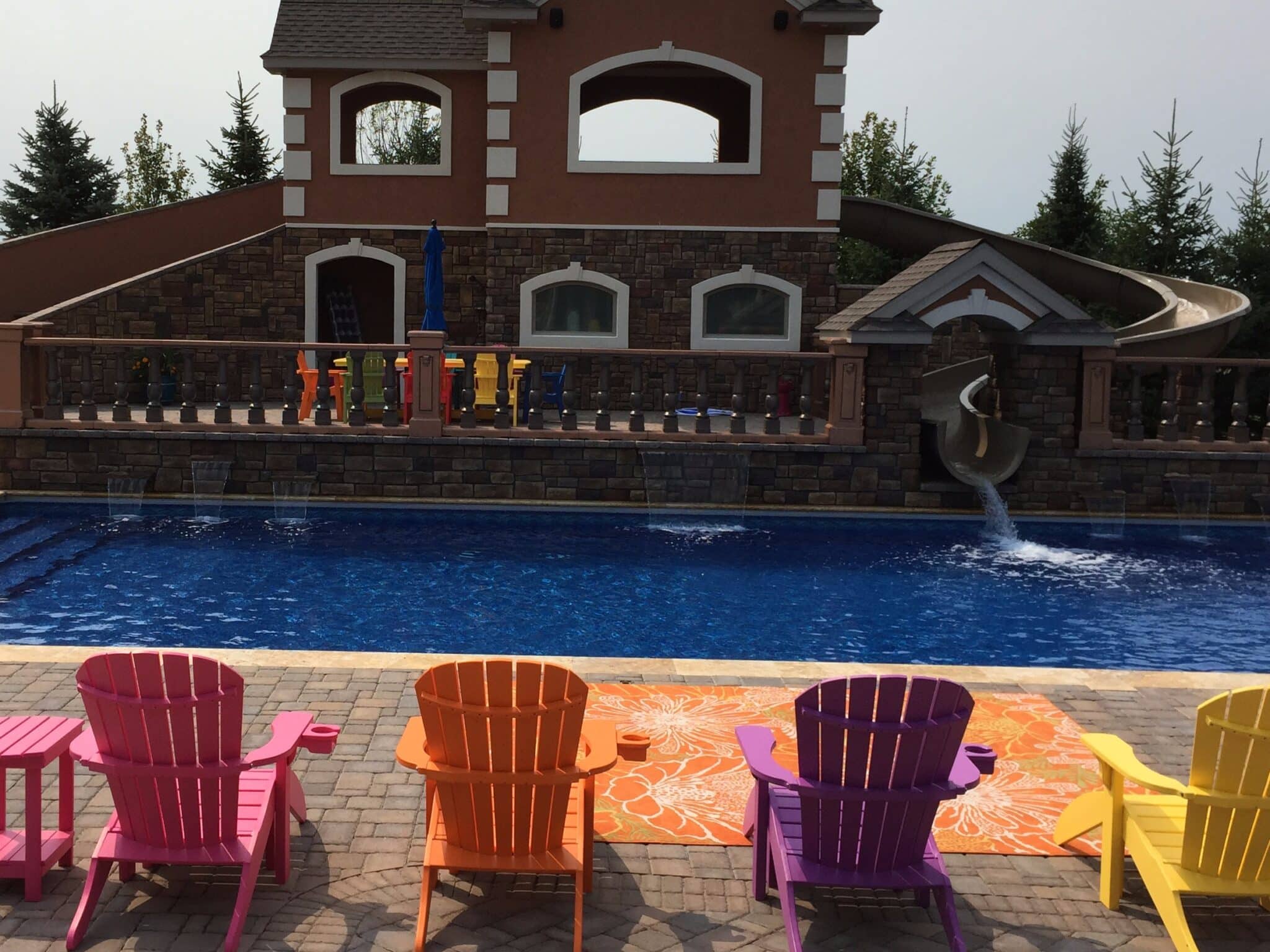 backyard pool with giant slide.