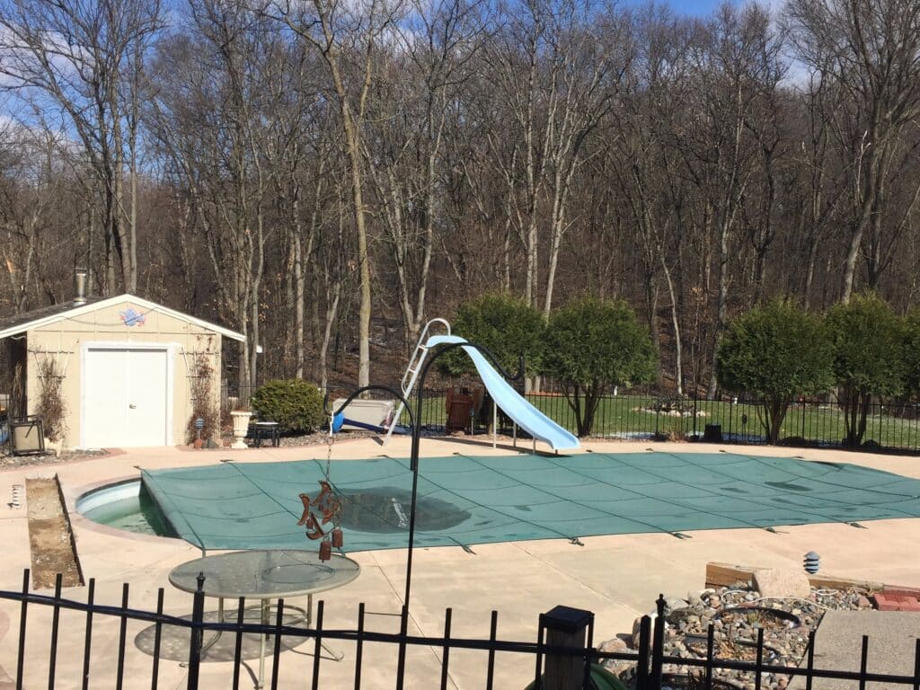 Safety cover on a pool being remodeled.